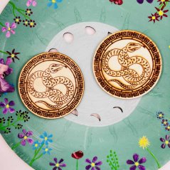 Wooden coaster with a snake for transformation, intuition and energy